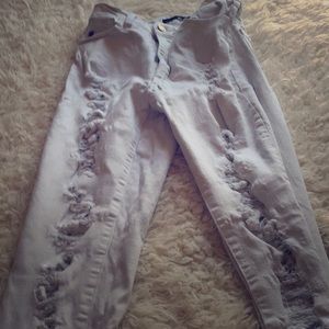 Women’s distressed white jeans